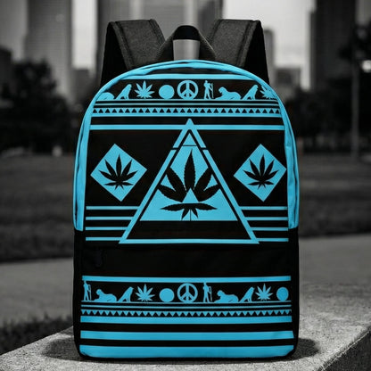 Wide shot of the NGU Gamma Blue backpack resting on a concrete surface in an urban park setting with a monochromatic city skyline background.