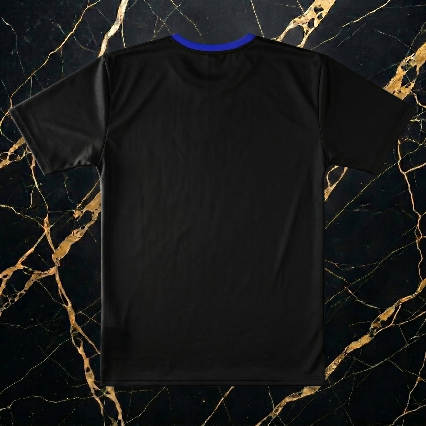 Flat lay product display of NGU Vanguard print-all-over technical polyester shirt paired with purple distressed stacked jeans and Deep Royal Blue Foamposites on a clean white marble surface.