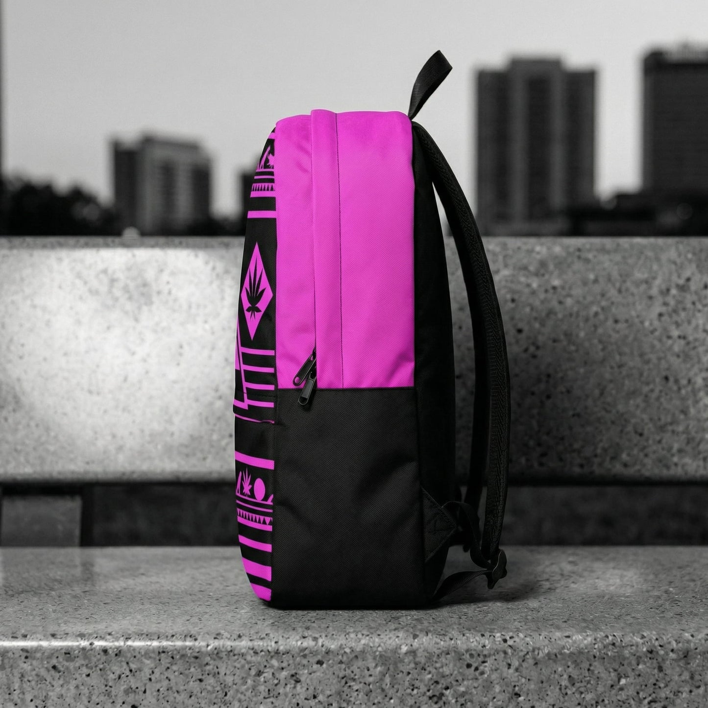 Side profile view of NGU streetwear backpack on concrete, showing 600D fabric depth and matte black stealth hardware, Noir selective color.