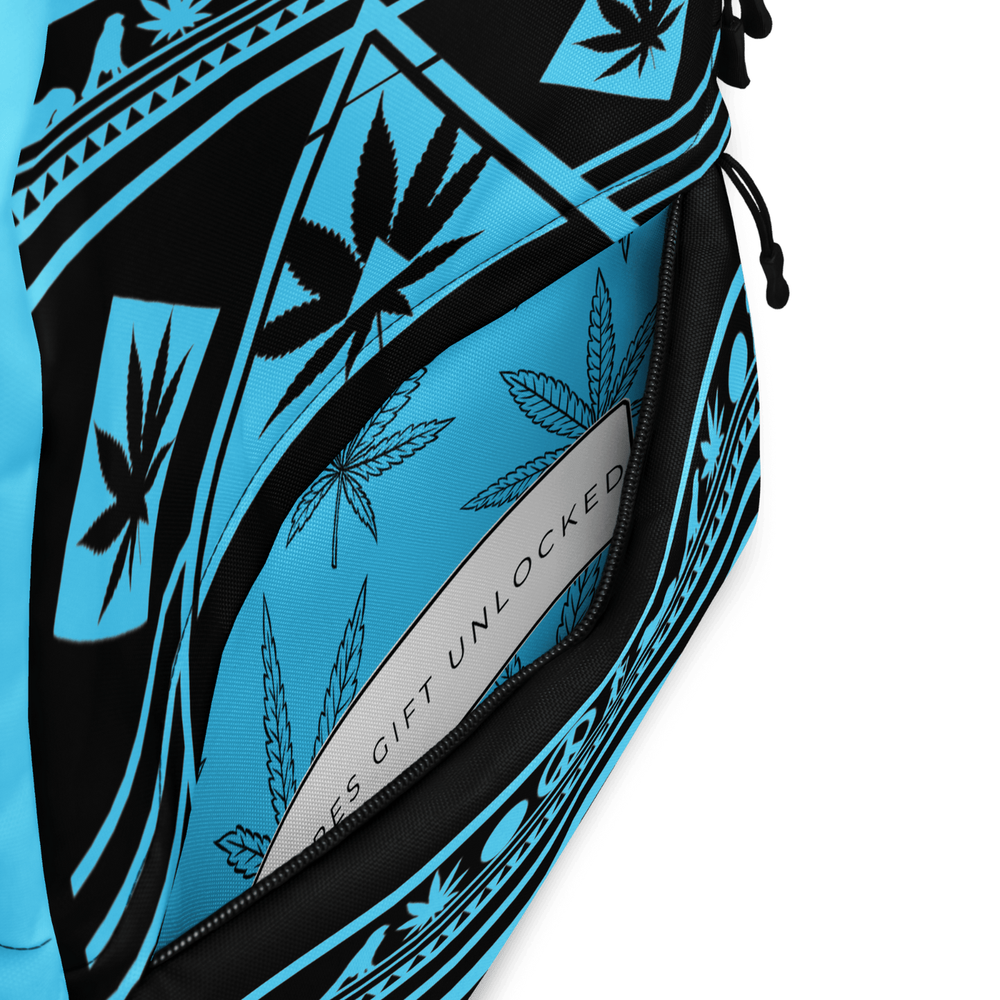 Close-up detail of the cyan-blue AOP print on the front panel of the NGU backpack showing high-fidelity cannabis leaf patterns.
