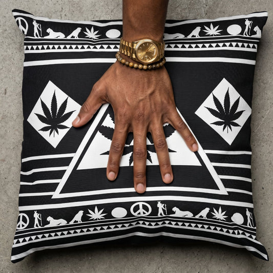 Macro shot of a mocha-skinned hand with a gold fluted watch pressing into the center of the Black and White NGU Architect pillow, creating realistic fabric tension and compression on the 275gsm canvas.