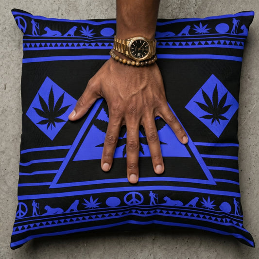 Macro shot of a mocha-skinned hand with a gold fluted watch pressing into the center of the Blue NGU Architect pillow, creating realistic fabric tension and compression on the 275gsm canvas.