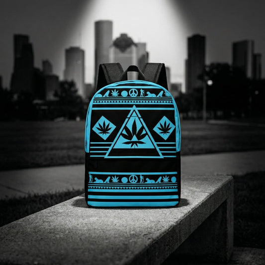 Wide shot of the NGU Gamma Blue backpack resting on a concrete surface in an urban park setting with a monochromatic city skyline background.