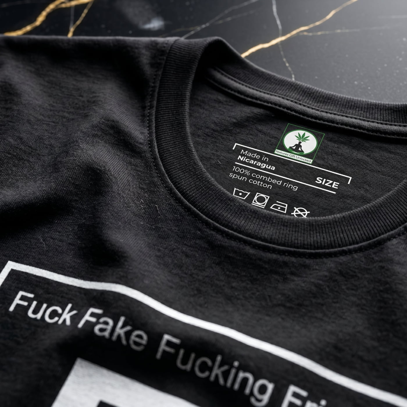 Interior neck branding of the NGU "Fuck Fake Fucking Friends" tee, showing the 400gsm ultra-heavyweight cotton quality and official NGU logo