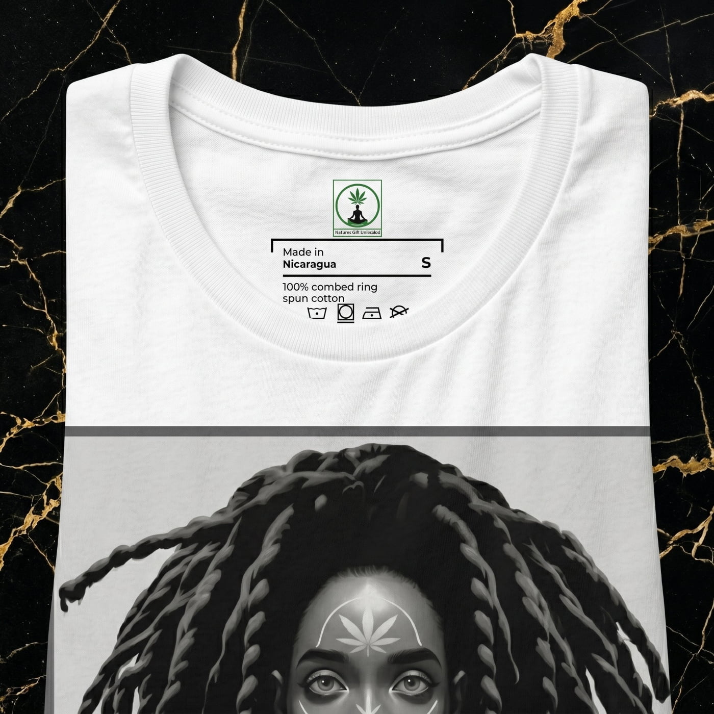 Front view of the NGU Monochrome Muse white 400gsm heavyweight graphic tee featuring black and white cannabis girl art on Portoro marble