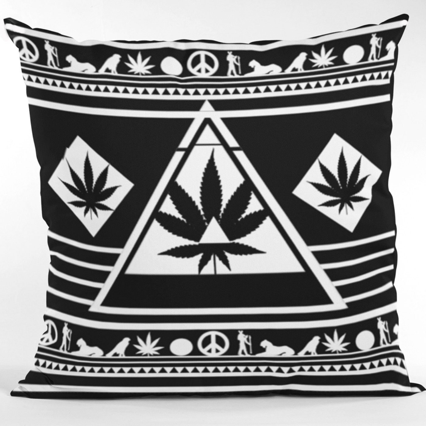 Front view of the Black and White NGU Architect pillow on a concrete pedestal, featuring a white weed leaf manifesto graphic on a 275gsm black matte-weave canvas with a perfectly upward-pointing white triangle.